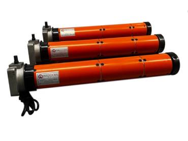 Three orange electric linear actuators with black end caps and mounting hardware, aligned together.
